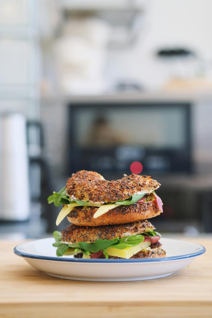 A scrumptious multigrain sandwich stacked with fresh ingredients, perfect for a healthy meal.